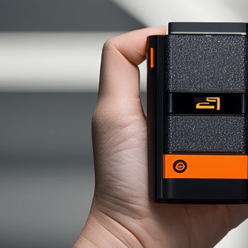 -up of a person's hand holding a black Ledger Nano S, with the orange logo in the center
